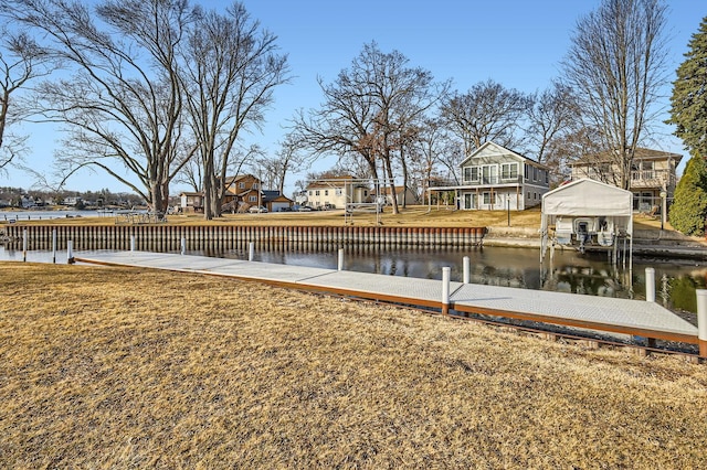 view of dock featuring a yard and a water view