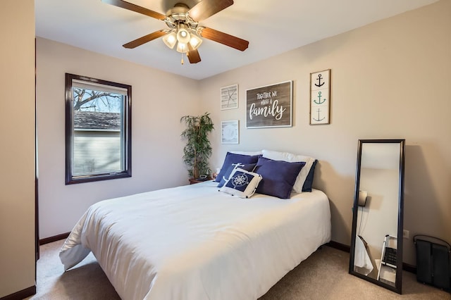 carpeted bedroom with baseboards and ceiling fan