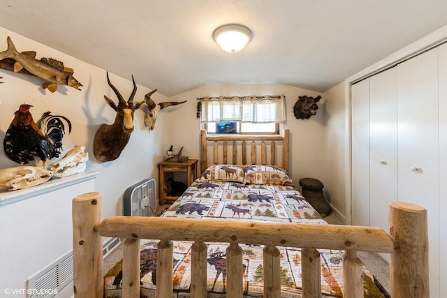 bedroom featuring a closet and vaulted ceiling