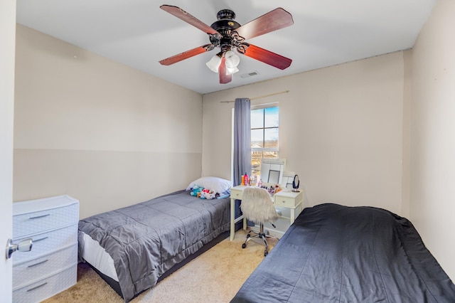 bedroom featuring ceiling fan, carpet floors, and visible vents