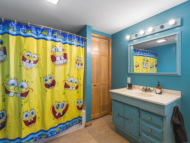 bathroom featuring shower / tub combo and vanity