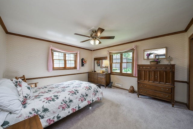 bedroom featuring crown molding, multiple windows, carpet flooring, wallpapered walls, and ceiling fan