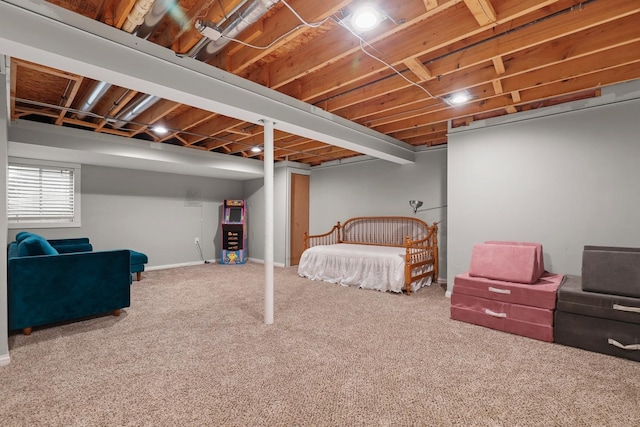 below grade area featuring carpet flooring and baseboards