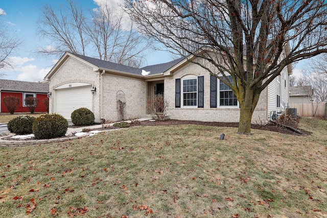 single story home with a garage, a shingled roof, a front yard, and brick siding