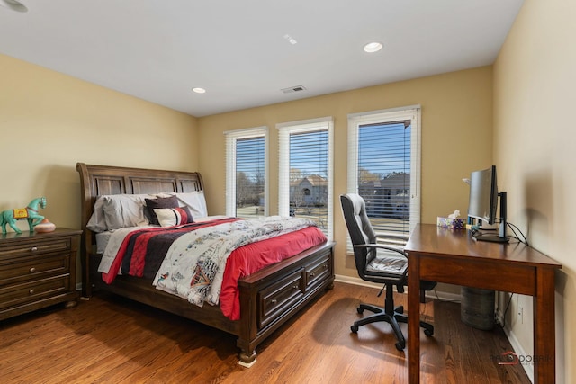 bedroom featuring visible vents, recessed lighting, and wood finished floors