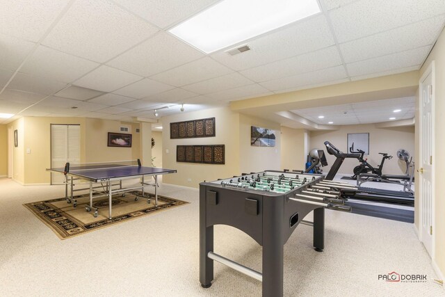 game room featuring carpet flooring, a paneled ceiling, visible vents, and baseboards