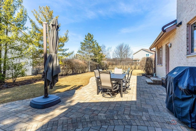 view of patio with outdoor dining space and area for grilling