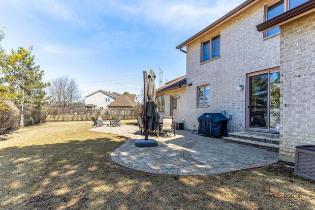 view of yard featuring fence and a patio area