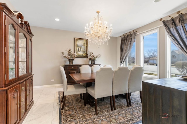 dining area featuring recessed lighting, baseboards, and a chandelier