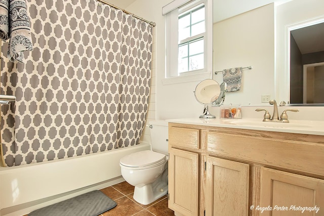 full bath featuring shower / tub combo with curtain, vanity, toilet, and tile patterned floors