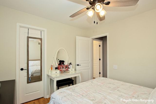 bedroom featuring a ceiling fan and light wood-type flooring