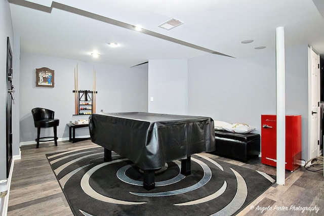 interior space featuring baseboards, billiards, visible vents, and wood finished floors