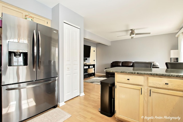 kitchen with baseboards, a ceiling fan, stainless steel fridge with ice dispenser, light brown cabinetry, and light wood-type flooring