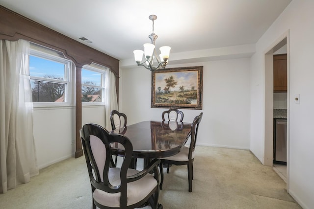 dining space featuring visible vents, light carpet, baseboards, and an inviting chandelier