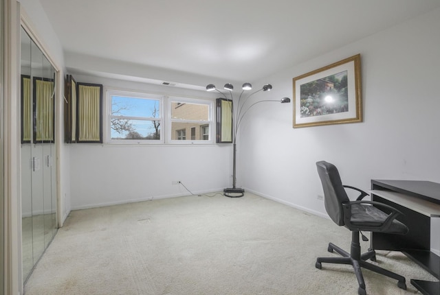 carpeted home office featuring visible vents and baseboards