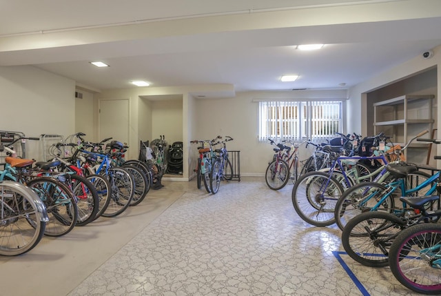 garage with visible vents, bike storage, and baseboards