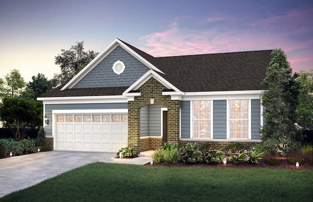 view of front of property featuring a shingled roof, concrete driveway, brick siding, and a lawn