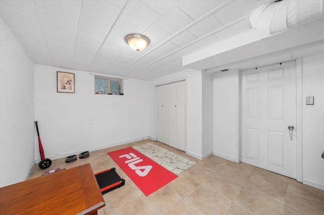 finished basement with visible vents and baseboards