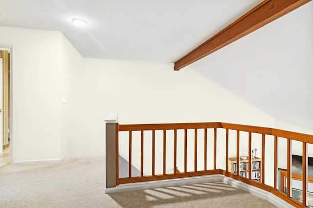 corridor featuring vaulted ceiling with beams and carpet