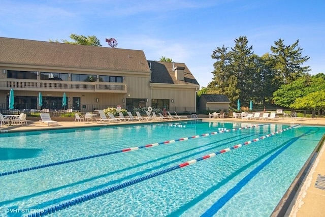 pool featuring a patio area and fence