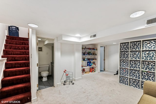 bathroom with visible vents, toilet, and baseboards