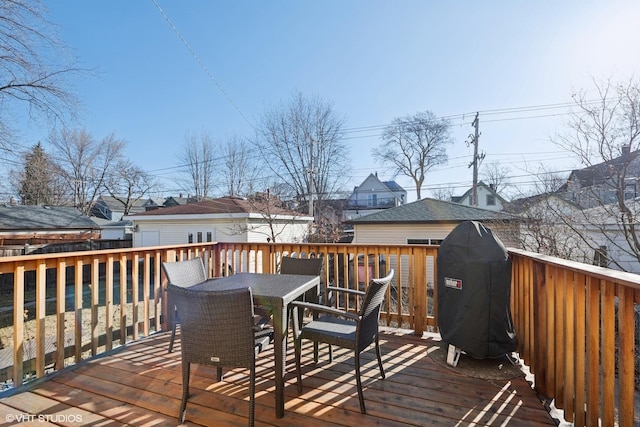 wooden terrace featuring outdoor dining space