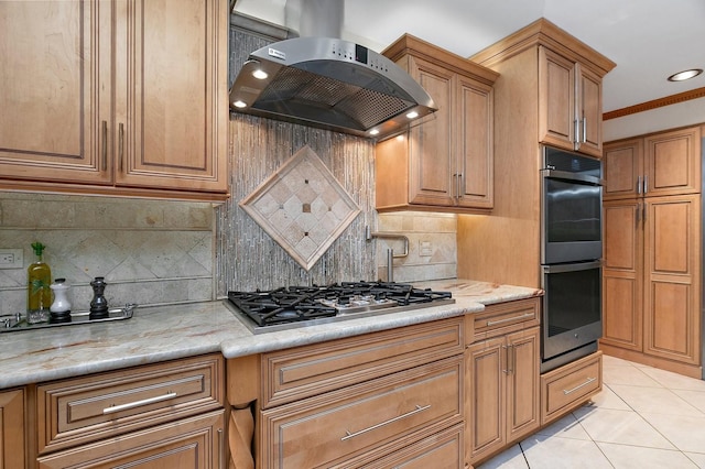 kitchen with light tile patterned floors, decorative backsplash, range hood, double oven, and stainless steel gas stovetop