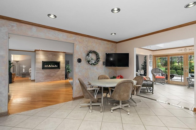 dining area with recessed lighting, crown molding, and light tile patterned floors