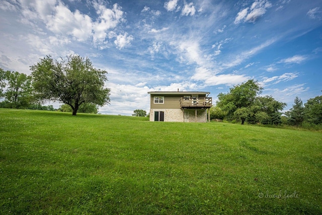 view of yard with a wooden deck