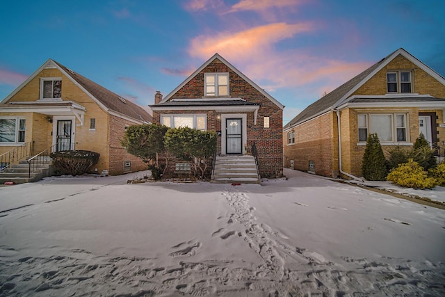 view of front of home featuring brick siding