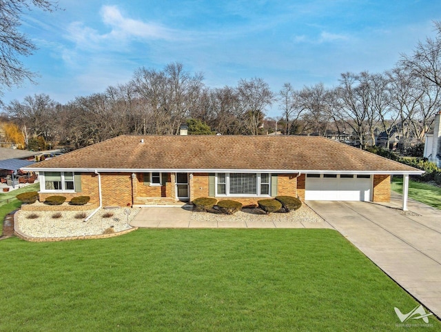 single story home with a garage, brick siding, concrete driveway, and a front yard