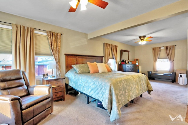 bedroom featuring a ceiling fan, beam ceiling, and light colored carpet