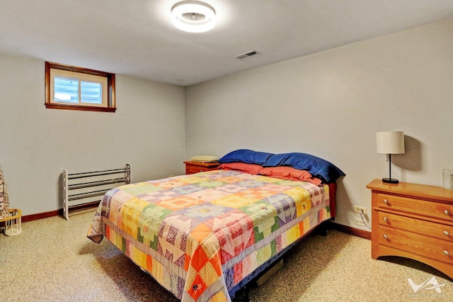 bedroom featuring visible vents, baseboards, and speckled floor