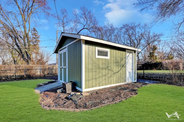 view of shed with a fenced backyard