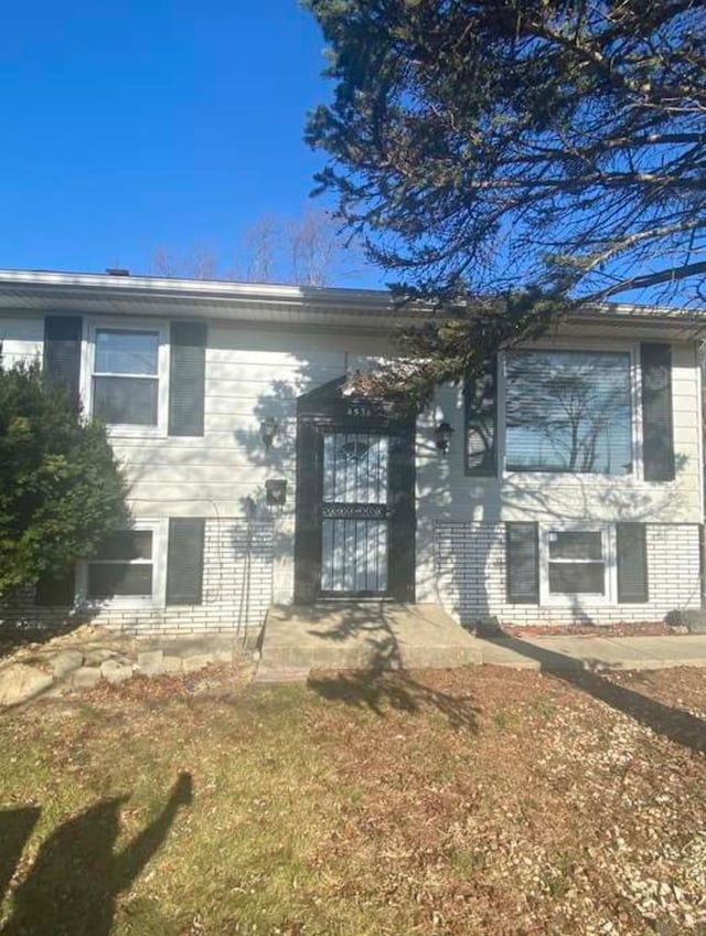 entrance to property with brick siding