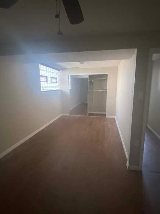 spare room with carpet and baseboards