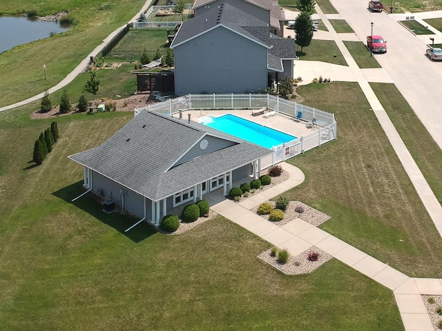 birds eye view of property with a water view