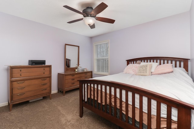 bedroom featuring light carpet, ceiling fan, and baseboards