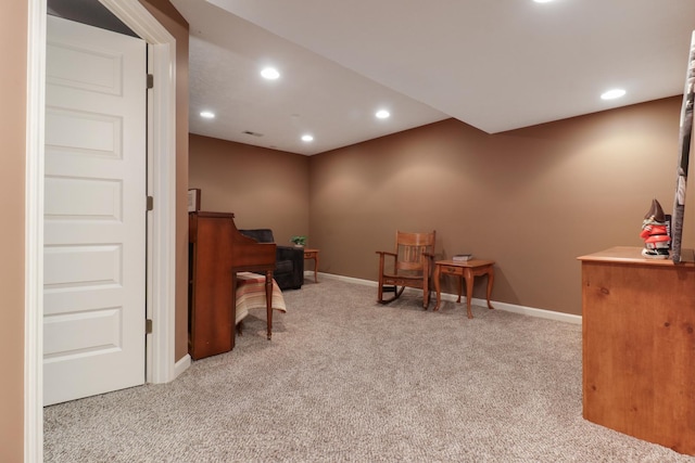 sitting room featuring baseboards, carpet flooring, and recessed lighting