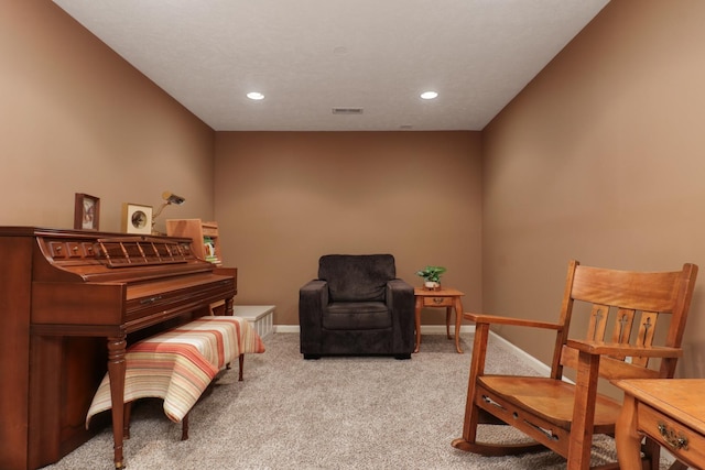 sitting room with carpet, visible vents, baseboards, and recessed lighting