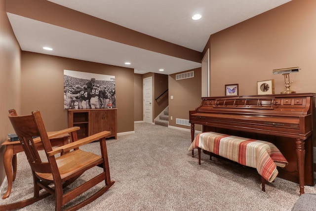 living area with recessed lighting, carpet flooring, visible vents, baseboards, and stairs