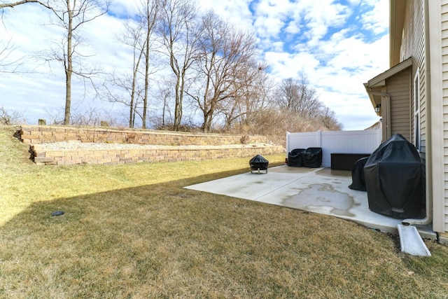 view of yard with fence and a patio