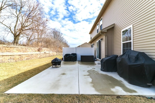 view of patio featuring fence and area for grilling