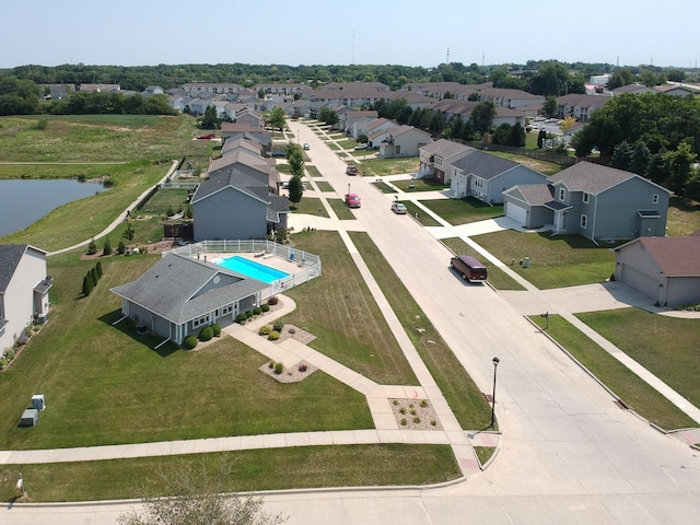 bird's eye view featuring a water view and a residential view