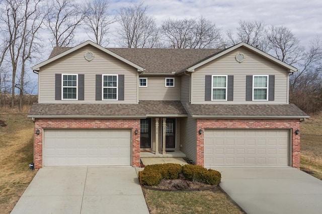 view of front of house featuring concrete driveway, a shingled roof, an attached garage, and brick siding