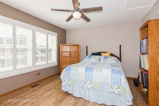 bedroom with visible vents, ceiling fan, light wood-type flooring, and baseboards