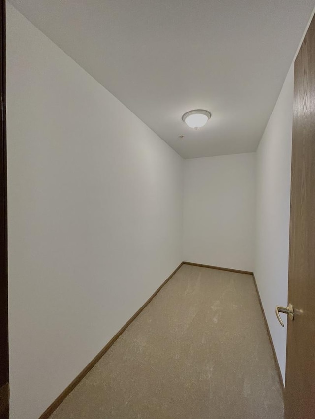 unfurnished room featuring baseboards