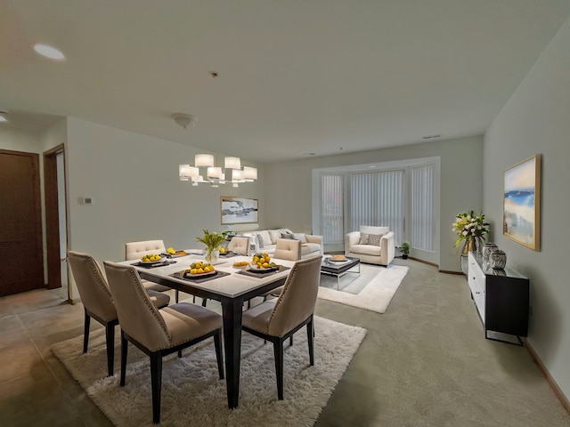 dining space with a chandelier and baseboards