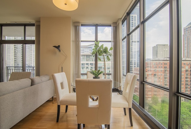 1322 S Prairie Ave Unit 1413, Chicago, IL 60605 - dining space with floor to ceiling windows, healthy amount of natural light, wood finished floors, and a city view