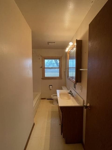 bathroom with visible vents, toilet, vanity, walk in shower, and tile patterned floors